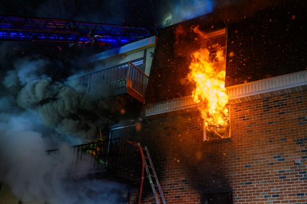 Firefighters respond to a fire Saturday evening Dec. 13, 2025, at the Fairmont Place Apartments on Maryland Circle in Whitehall Township. (Scott M. Nagy/Special to The Morning Call)