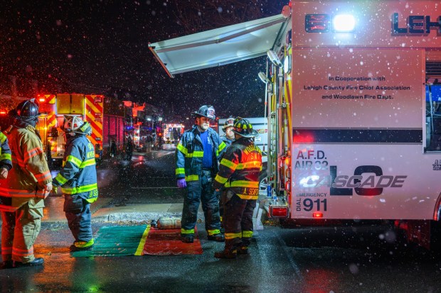 Firefighters respond to a fire Saturday evening Dec. 13, 2025, at the Fairmont Place Apartments on Maryland Circle in Whitehall Township. (Scott M. Nagy/Special to The Morning Call)