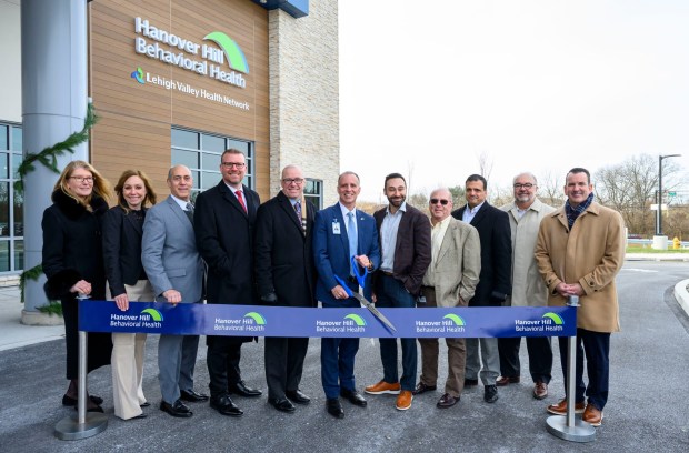 Hanover Hill Behavioral Health CEO Ryan Tatu and others celebrate Monday, Dec. 8, 2025, during a ribbon-cutting ceremony for Hanover Hill Behavioral Health, a three-story, 144-bed behavioral health hospital in Hanover Township, Northampton County. The hospital represents a joint venture between Lehigh Valley Health Network, part of Jefferson Health, and Universal Health Services. (April Gamiz/The Morning Call)