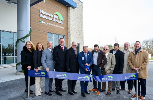 Hanover Hill Behavioral Health CEO Ryan Tatu and others celebrate Monday, Dec. 8, 2025, during a ribbon-cutting ceremony for Hanover Hill Behavioral Health, a three-story, 144-bed behavioral health hospital in Hanover Township, Northampton County. The hospital represents a joint venture between Lehigh Valley Health Network, part of Jefferson Health, and Universal Health Services. (April Gamiz/The Morning Call)