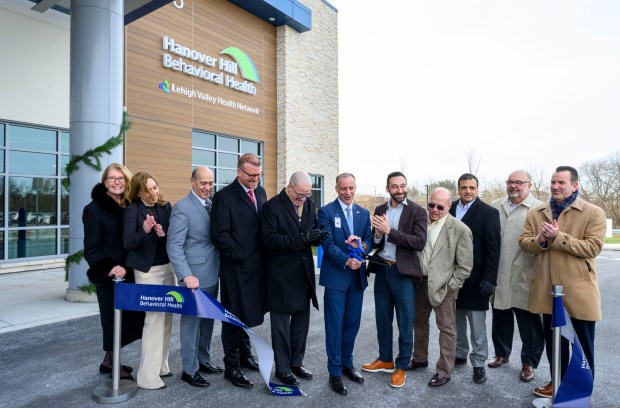 Hanover Hill Behavioral Health CEO Ryan Tatu and others celebrate Monday, Dec. 8, 2025, during a ribbon-cutting ceremony for Hanover Hill Behavioral Health, a three-story, 144-bed behavioral health hospital in Hanover Township, Northampton County. The hospital represents a joint venture between Lehigh Valley Health Network, part of Jefferson Health, and Universal Health Services. (April Gamiz/The Morning Call)