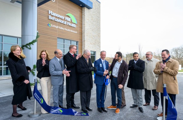 Hanover Hill Behavioral Health CEO Ryan Tatu and others celebrate Monday, Dec. 8, 2025, during a ribbon-cutting ceremony for Hanover Hill Behavioral Health, a three-story, 144-bed behavioral health hospital in Hanover Township, Northampton County. The hospital represents a joint venture between Lehigh Valley Health Network, part of Jefferson Health, and Universal Health Services. (April Gamiz/The Morning Call)