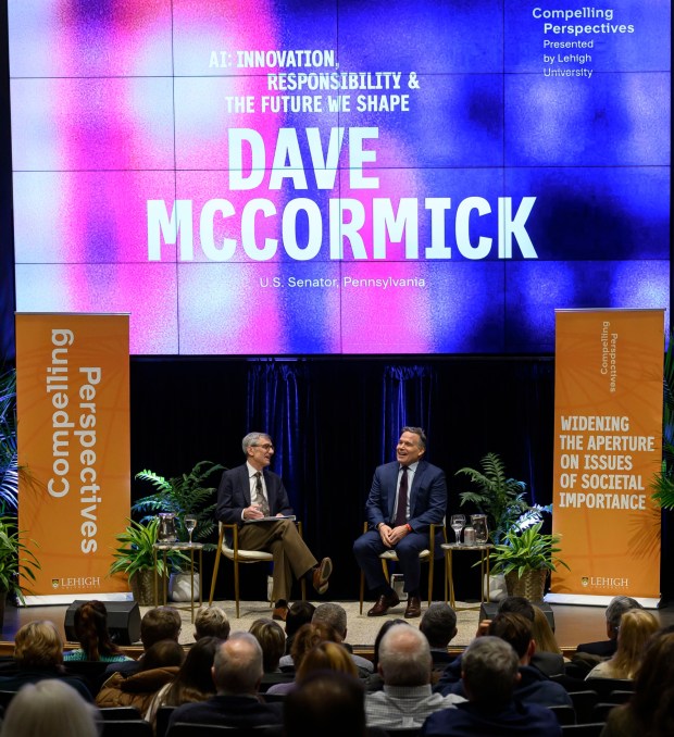U.S. Sen. Dave McCormick, R-Pa., discusses the government's role in supporting artificial intelligence and innovation with Lehigh University President Joseph J. Helble on Thursday, Dec. 4, 2025, during Lehigh University's Compelling Perspectives program at the school's Packard Laboratory Room in Bethlehem. (April Gamiz/The Morning Call)