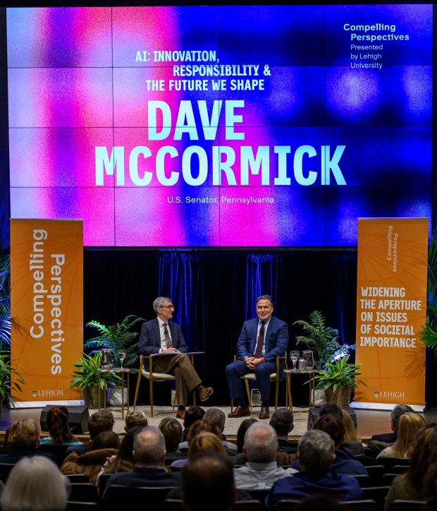 U.S. Sen. Dave McCormick, R-Pa., discusses the government's role in supporting artificial intelligence and innovation with Lehigh University President Joseph J. Helble on Thursday, Dec. 4, 2025, during Lehigh University's Compelling Perspectives program at the school's Packard Laboratory Room in Bethlehem. (April Gamiz/The Morning Call)