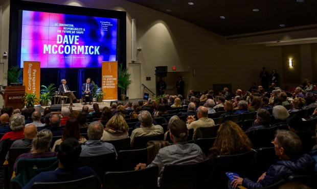 U.S. Sen. Dave McCormick, R-Pa., discusses the government's role in supporting artificial intelligence and innovation with Lehigh University President Joseph J. Helble on Thursday, Dec. 4, 2025, during Lehigh University's Compelling Perspectives program at the school's Packard Laboratory Room in Bethlehem. (April Gamiz/The Morning Call)