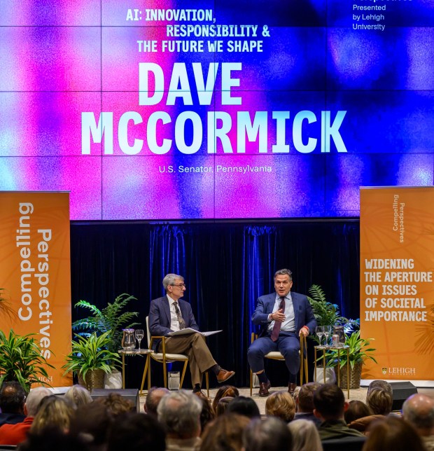 U.S. Sen. Dave McCormick, R-Pa., discusses the government's role in supporting artificial intelligence and innovation with Lehigh University President Joseph J. Helble on Thursday, Dec. 4, 2025, during Lehigh University's Compelling Perspectives program at the school's Packard Laboratory Room in Bethlehem. (April Gamiz/The Morning Call)