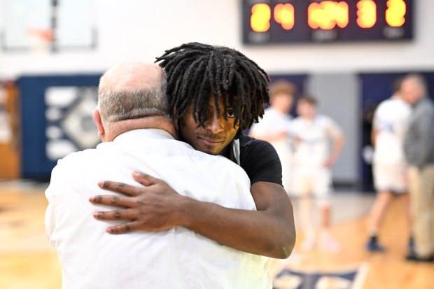 Catasauqua's coach Eric Snyder, congratulates Frankie Pujols after he scored his 1,000th career point. Catty beat Pleasant Valley in he semifinals of the Slatington Rotary Tournament at Northern Lehigh Monday night. (Jonathan Broady/Special to The Morning Call)