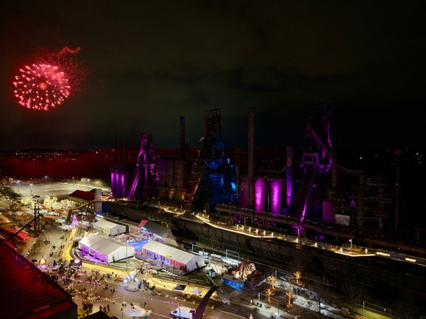 Fireworks light the sky during the first night of PeepsFest on Tuesday, Dec. 30, 2025, at SteelStacks in Bethlehem. Revelers braved freezing cold temperatures and high winds to witness the annual Peeps chick drop, which will be done again Wednesday night. (Rich Rolen/Special to The Morning Call)
