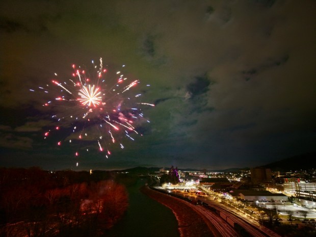 Fireworks light the sky during the first night of PeepsFest on Tuesday, Dec. 30, 2025, at SteelStacks in Bethlehem. Revelers braved freezing cold temperatures and high winds to witness the annual Peeps chick drop, which will be done again Wednesday night. (Rich Rolen/Special to The Morning Call)