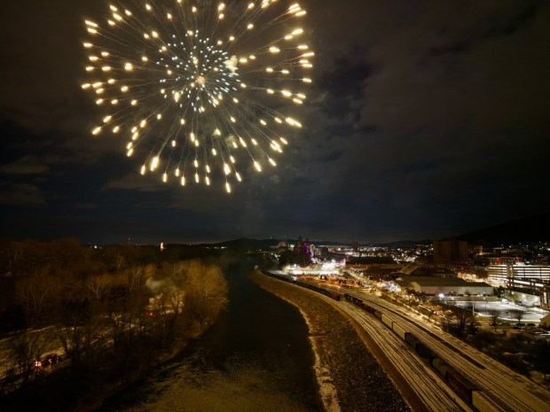 Fireworks light the sky during the first night of PeepsFest on Tuesday, Dec. 30, 2025, at SteelStacks in Bethlehem. Revelers braved freezing cold temperatures and high winds to witness the annual Peeps chick drop, which will be done again Wednesday night. (Rich Rolen/Special to The Morning Call)