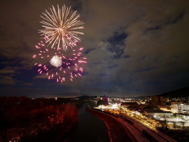 Fireworks light the sky during the first night of PeepsFest on Tuesday, Dec. 30, 2025, at SteelStacks in Bethlehem. Revelers braved freezing cold temperatures and high winds to witness the annual Peeps chick drop, which will be done again Wednesday night. (Rich Rolen/Special to The Morning Call)
