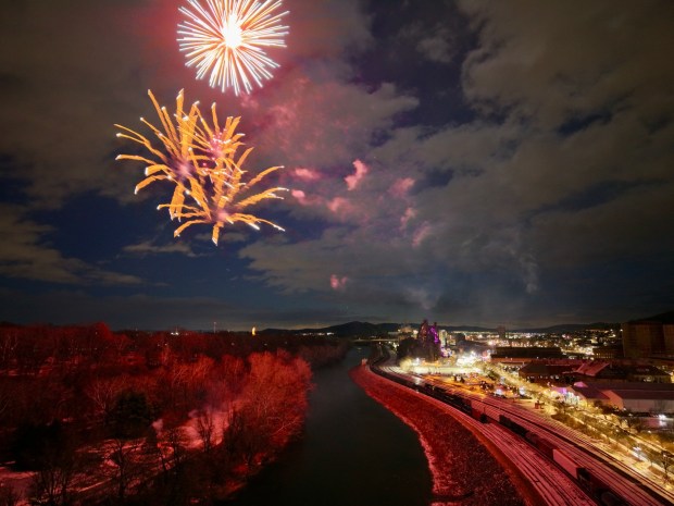 Fireworks light the sky during the first night of PeepsFest on Tuesday, Dec. 30, 2025, at SteelStacks in Bethlehem. Revelers braved freezing cold temperatures and high winds to witness the annual Peeps chick drop, which will be done again Wednesday night. (Rich Rolen/Special to The Morning Call)