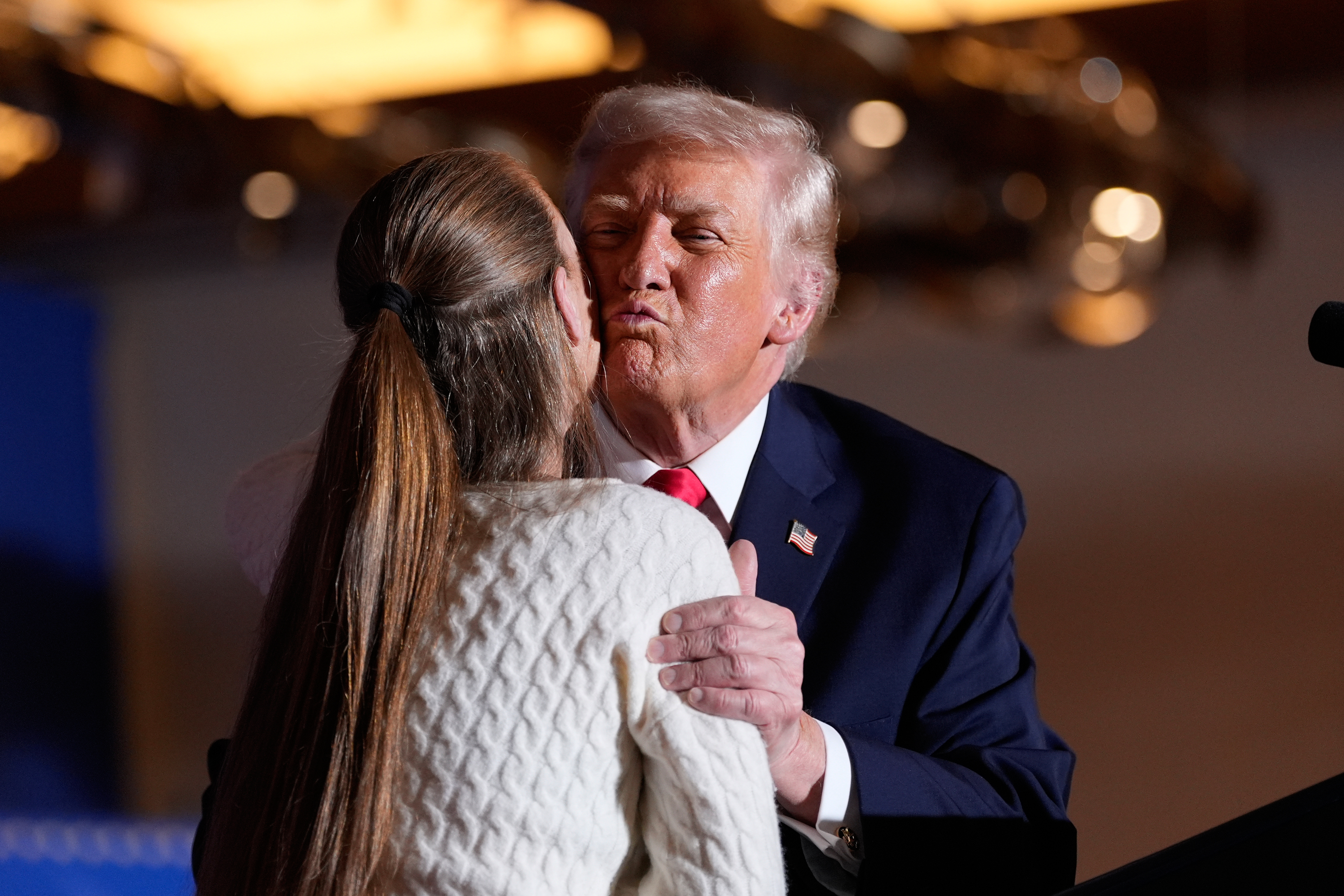 President Donald Trump embraces Donna Zajack after he invited her...