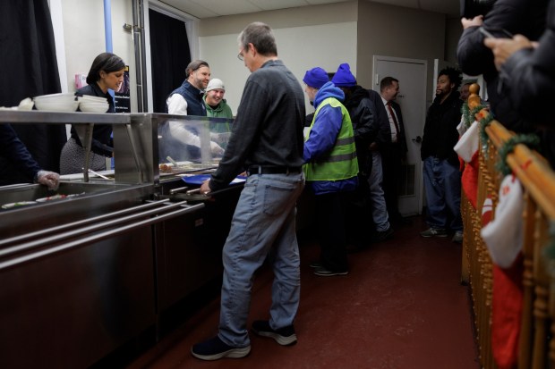 Vice President JD Vance and second lady Usha Vance serve food to attendees at the Allentown Rescue Mission in Allentown on Tuesday, Dec. 16, 2025. (Tom Brenner/The New York Times via AP, Pool)