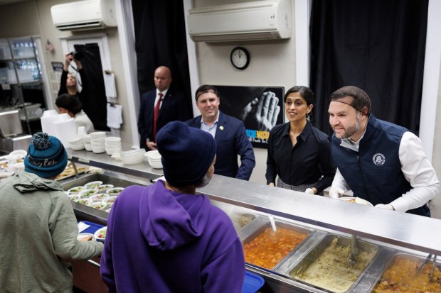 Vice President JD Vance and second lady Usha Vance serve food to attendees at the Allentown Rescue Mission in Allentown on Tuesday, Dec. 16, 2025. (Tom Brenner/The New York Times via AP, Pool)