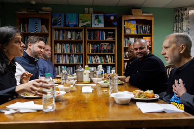Vice President JD Vance and second lady Usha Vance share a meal with individuals in recovery at the Allentown Rescue Mission in Allentown on Tuesday, Dec. 16, 2025. (Tom Brenner/The New York Times via AP, Pool)