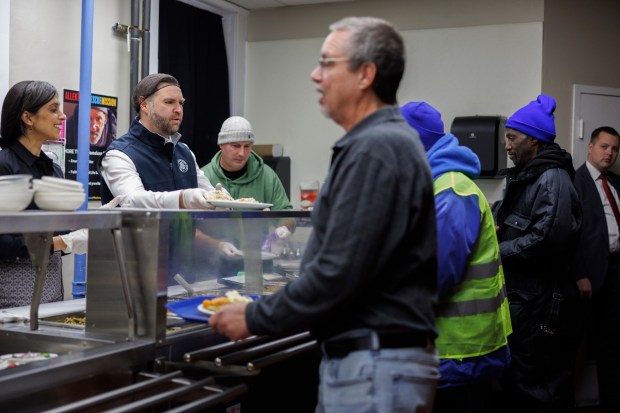 Vice President JD Vance and second lady Usha Vance share a meal with individuals in recovery at the Allentown Rescue Mission in Allentown on Tuesday, Dec. 16, 2025. (Tom Brenner/The New York Times via AP, Pool)