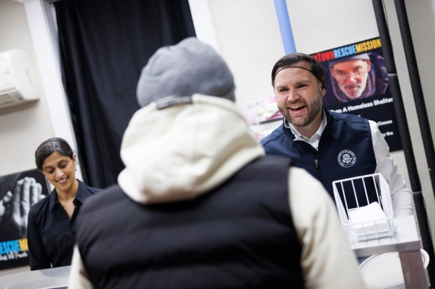 Vice President JD Vance and second lady Usha Vance serve food to attendees at the Allentown Rescue Mission in Allentown on Tuesday, Dec. 16, 2025. (Tom Brenner/The New York Times via AP, Pool)