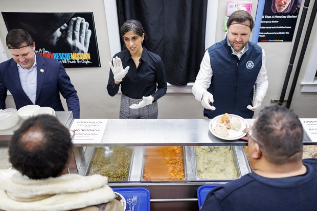 Vice President JD Vance and second lady Usha Vance serve food to attendees at the Allentown Rescue Mission in Allentown on Tuesday, Dec. 16, 2025. (Tom Brenner/The New York Times via AP, Pool)