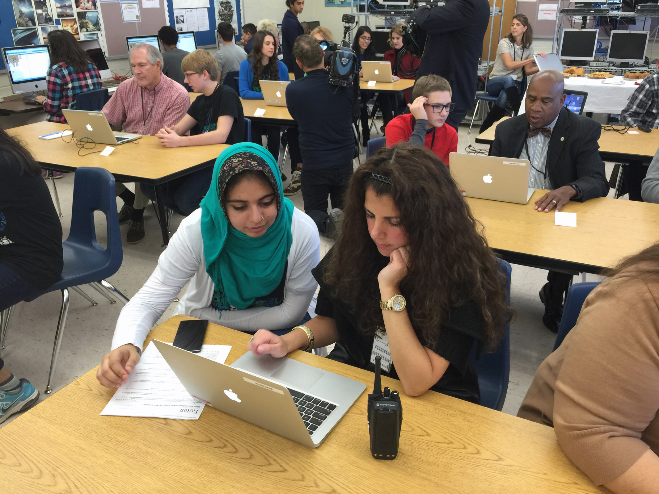 Mentors work Dec. 7, 2015, with novice coders during Easton...