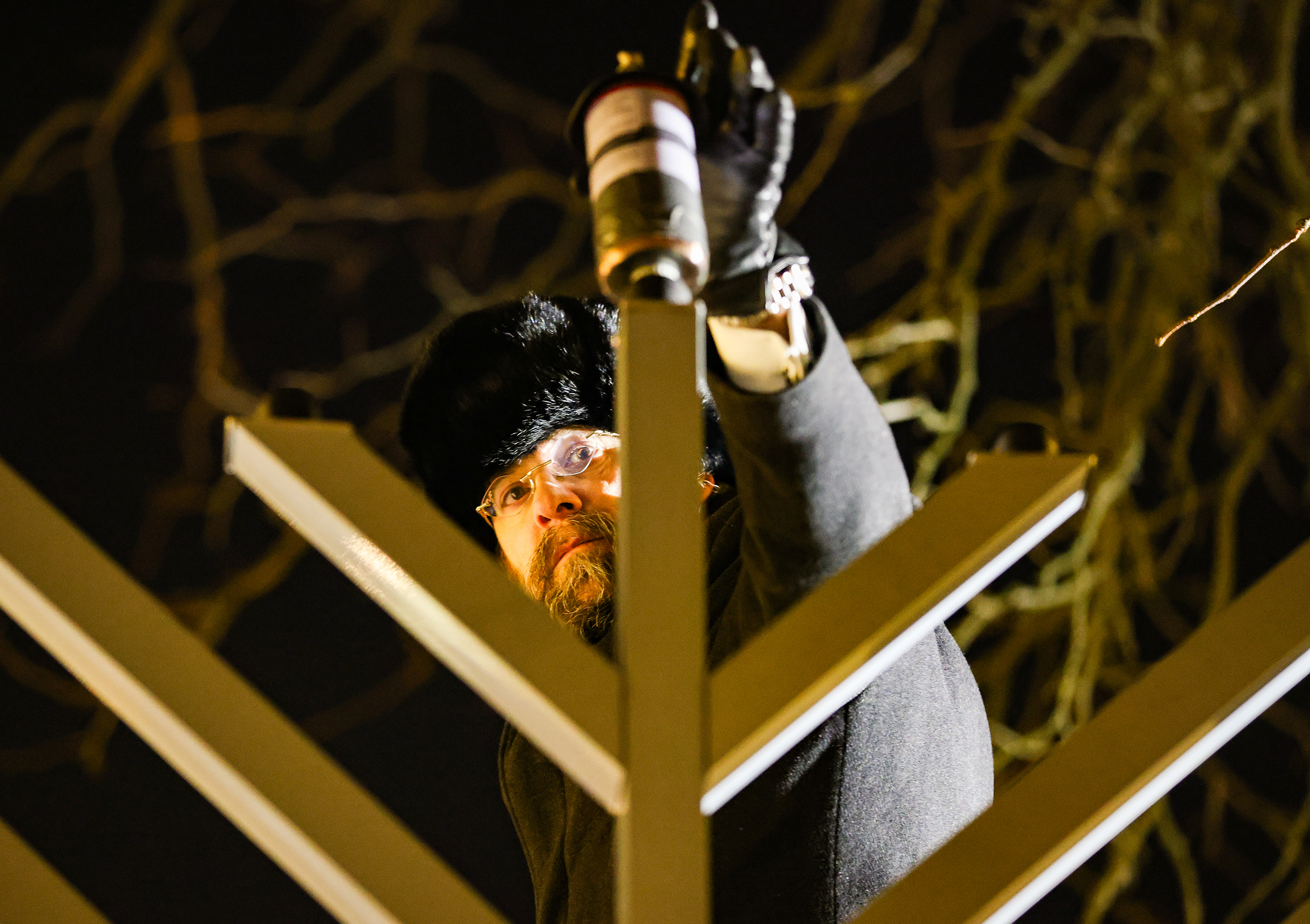 Rabbi Yaakov Halperin preps the menorah before lighting at Payrow Plaza Monday evening.  Chabad Lubavitch of the Lehigh Valley celebrates Hanukkah with a "Lighting of Unity" public menorah lighting Monday, Dec. 15, 2025, on Payrow Plaza outside Bethlehem City Hall.