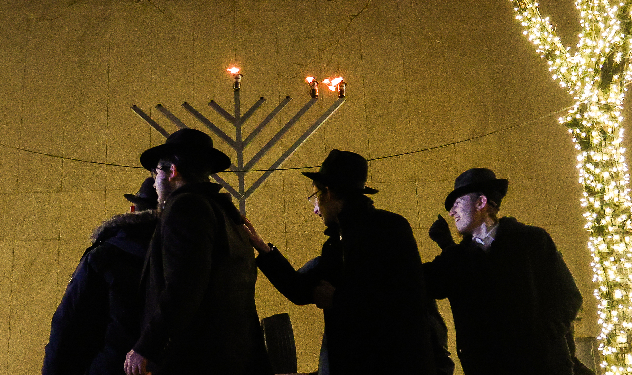 A group dances at the public menorah lighting Monday, Dec. 15, 2025, on Payrow Plaza outside Bethlehem City Hall.