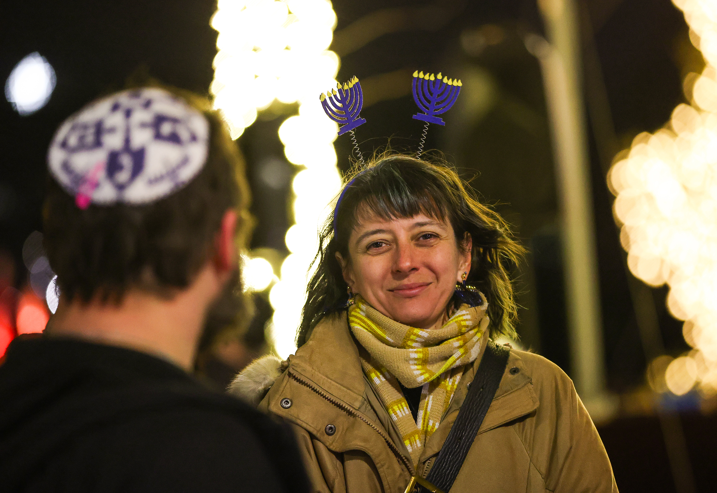 Jessica Morris, of Bethlehem, celebrates the lighting of the menorah Payrow Plaza Monday evening. Chabad Lubavitch of the Lehigh Valley celebrates Hanukkah with a "Lighting of Unity" public menorah lighting Monday, Dec. 15, 2025, on Payrow Plaza outside Bethlehem City Hall.
