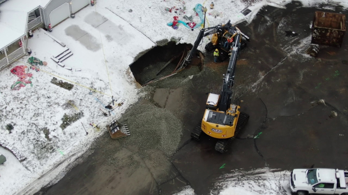 Sinkhole opens up and swallows car along 5th street in Blakely