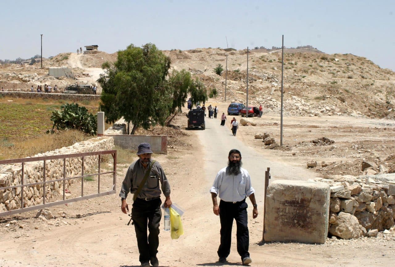 Israeli soldiers and police officers at the former Israeli military base, Ush al-Ghurab, at the edge of Beit Sahour outside of Bethlehem in February 2010. (Photo: Najeh Hashlamoun/APA Images)