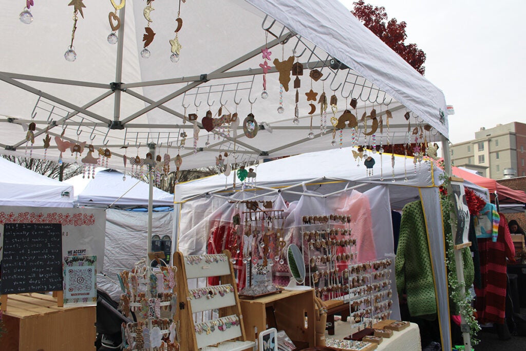 A variety of jewelry and other items are on display in an outdoor tent in Ardmore
