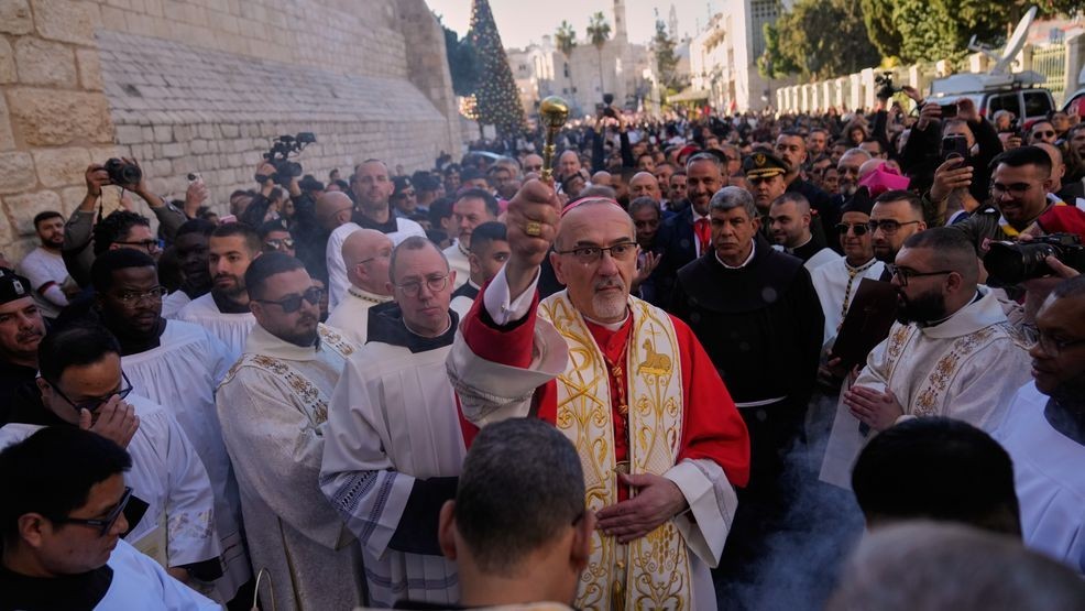 Latin Patriarch Pierbattista Pizzaballa, the top Catholic clergyman in the Holy Land, arrives at the Church of the Nativity, traditionally believed to be the birthplace of Jesus, on Christmas Eve, in the West Bank city of Bethlehem, Wednesday, Dec. 24, 2025. (AP Photo/Nasser Nasser)