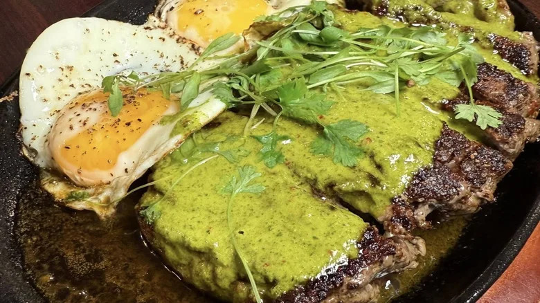 steak and eggs in a Mexican sauce