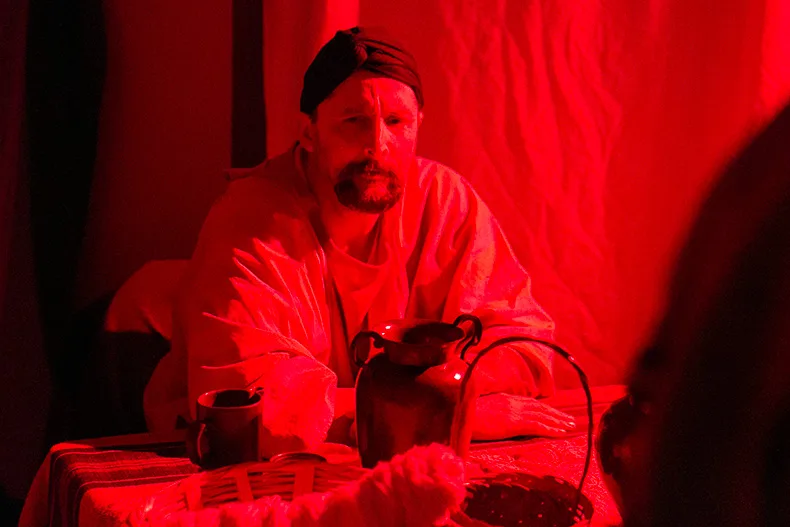 The shepherds take the travelers to an inn, where the innkeeper mentions a pregnant woman and man who were directed to a nearby stable because no more rooms were available. 