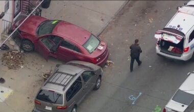 Philly officer hit during traffic stop before car crashes into home, officer uninjured