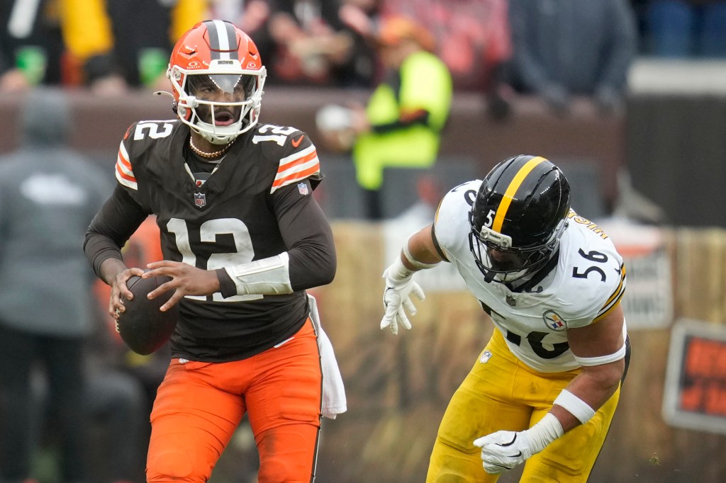 Browns quarterback Shedeur Sanders (12) runs from Steelers linebacker Alex Highsmith (56) on Dec. 28, 2025.