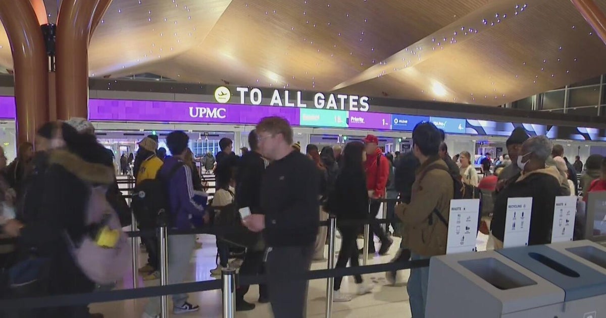 Passengers move through Pittsburgh International Airport as AAA forecasts record-breaking holiday travel