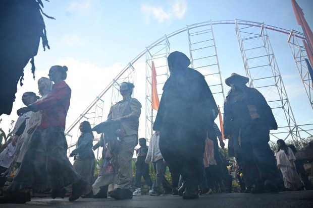 Actors scare visitors during media night at Dorney Park's Halloween Haunt on Friday, Sept. 26, 2025, in South Whitehall Township. The event features haunted mazes, scare zones and live entertainment, along with signature thrill rides in the dark. (Amy Shortell/The Morning Call)