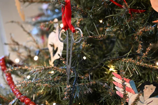 The Scherenschnitte tree is seen Sunday, Dec. 7, 2025, at the Moravian Museum of Bethlehem in the Single Sisters' House in Bethlehem during the "Trees of Historic Bethlehem" exhibition. The show, presented by Historic Bethlehem Museums & Sites, is back for the 2025 holiday season with a collection of the top Christmas trees and themes of the past 20 years. It runs through Jan. 11. (Amy Shortell/The Morning Call)