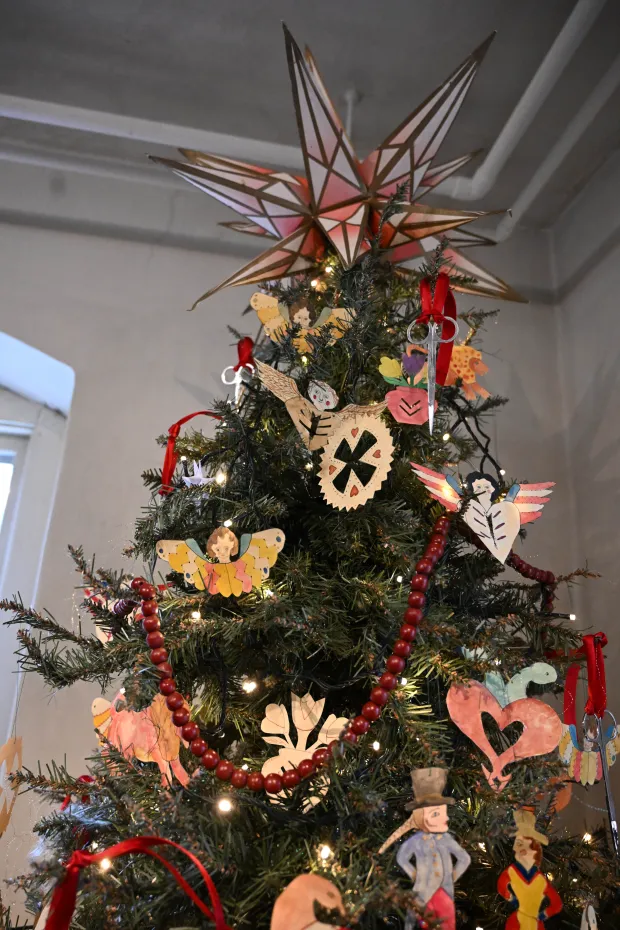 The Scherenschnitte tree is seen Sunday, Dec. 7, 2025, at the Moravian Museum of Bethlehem in the Single Sisters' House in Bethlehem during the "Trees of Historic Bethlehem" exhibition. The show, presented by Historic Bethlehem Museums & Sites, is back for the 2025 holiday season with a collection of the top Christmas trees and themes of the past 20 years. It runs through Jan. 11. (Amy Shortell/The Morning Call)