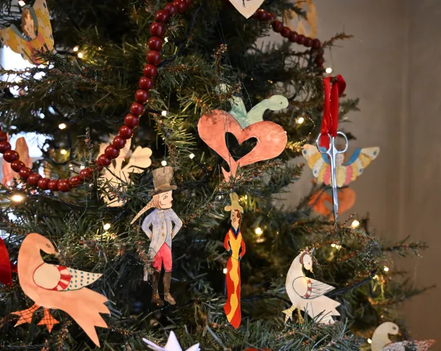 The Scherenschnitte tree is seen Sunday, Dec. 7, 2025, at the Moravian Museum of Bethlehem in the Single Sisters' House in Bethlehem during the "Trees of Historic Bethlehem" exhibition. The show, presented by Historic Bethlehem Museums & Sites, is back for the 2025 holiday season with a collection of the top Christmas trees and themes of the past 20 years. It runs through Jan. 11. (Amy Shortell/The Morning Call)