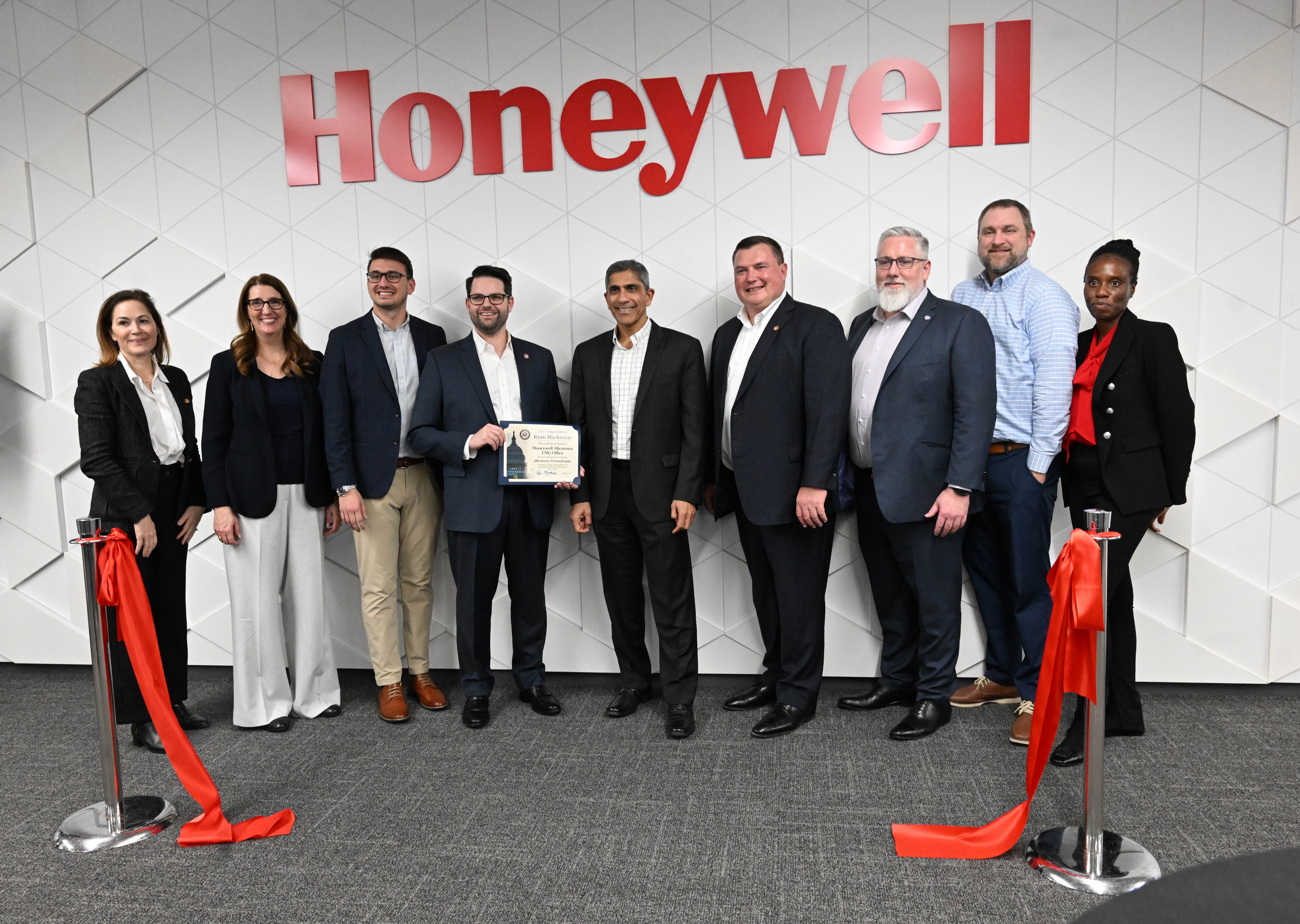 Honeywell officials cut the ribbon for the company’s new office...
