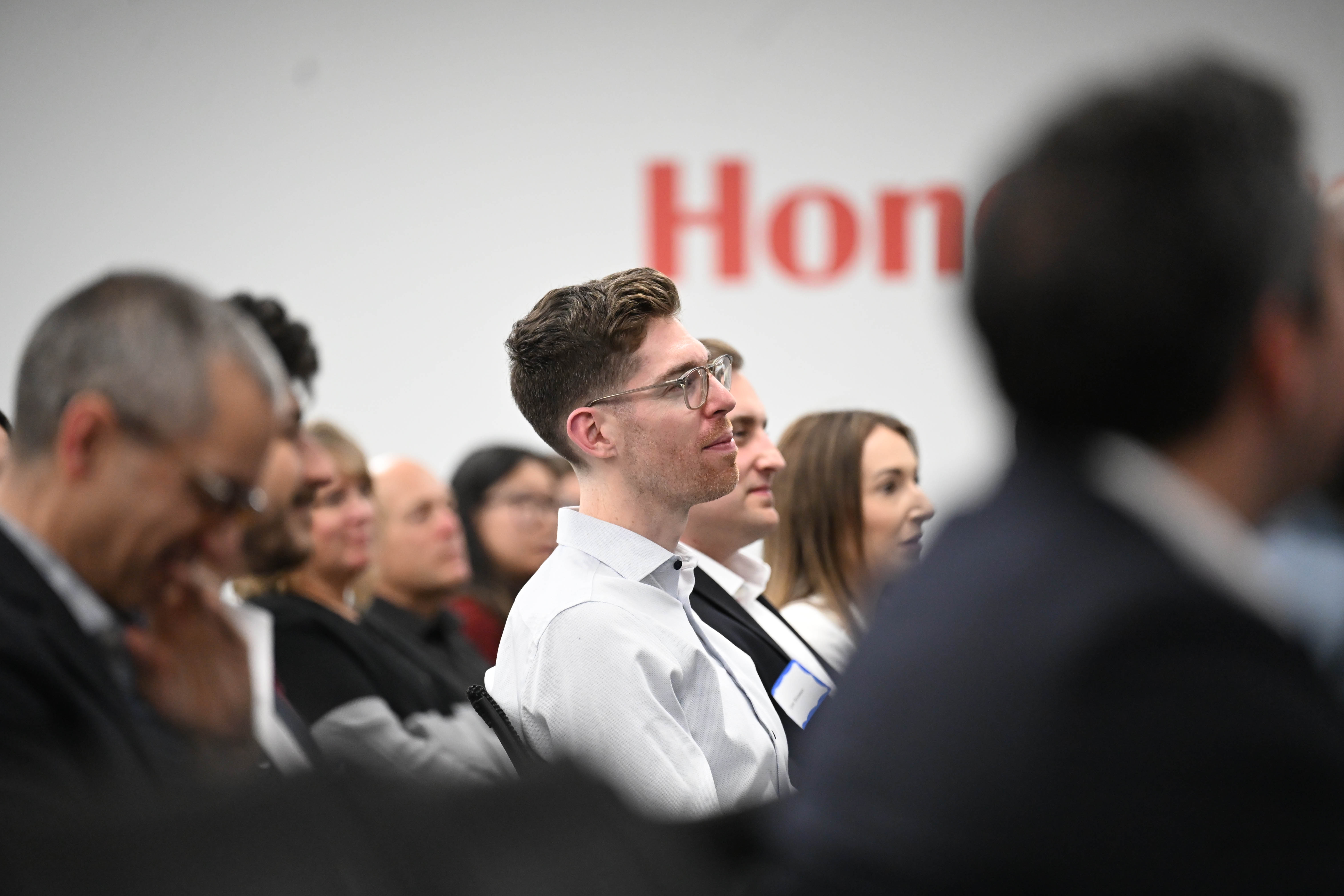 Employees listen as Vimal Kapur, chairman and CEO of Honeywell,...