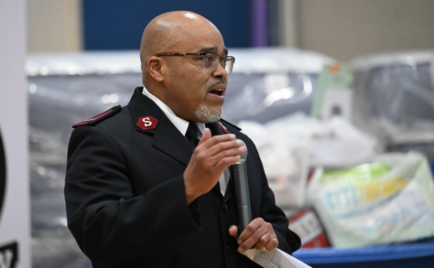 Salvation Army Maj. Ismael speaks Monday, Dec. 22, 2025, at the Salvation Army in Allentown. The Michael Ann and Saquon Barkley Hope Foundation, Salvation Army and Ashley's Furniture joined to donate beds, mattresses and toys to Lehigh Valley families in need, including some whose homes were burned in recent fires. (Amy Shortell/The Morning Call)