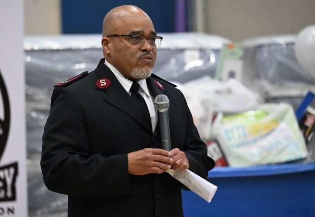 Salvation Army Maj. Ismael speaks Monday, Dec. 22, 2025, at the Salvation Army in Allentown. The Michael Ann and Saquon Barkley Hope Foundation, Salvation Army and Ashley's Furniture joined to donate beds, mattresses and toys to Lehigh Valley families in need, including some whose homes were burned in recent fires. (Amy Shortell/The Morning Call)