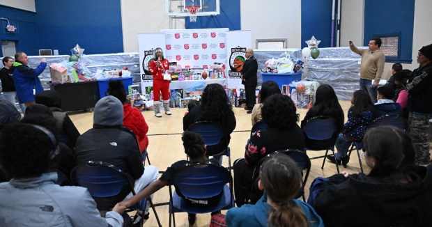 Tonya Johnson, All-Pro running back Saquon Barkley's mom and vice president of the Michael Ann and Saquon Barkley Hope Foundation, speaks Monday, Dec. 22, 2025, at the Salvation Army in Allentown. The foundation, Salvation Army and Ashley's Furniture joined to donate beds, mattresses and toys to Lehigh Valley families in need, including some whose homes were burned in recent fires. (Amy Shortell/The Morning Call)