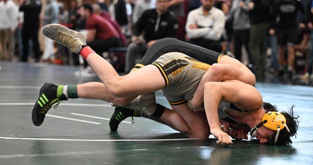 Freedom's Anthony Crisafulli wrestles Northwestern Lehigh's Trent Croll in the 145-pound bout Sunday, Dec. 28, 2025, during Day 1 of the Bethlehem Holiday Wrestling Classic at Liberty High School. (Amy Shortell/The Morning Call)
