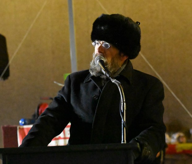 Rabbi Yaacov Halperin speaks before leading a prayer Monday, Dec. 15, 2025, during a Hanukkah menorah lighting at Payrow Plaza in Bethlehem. Monday was the second night of the eight-day Jewish Festival of Lights. (Amy Shortell/The Morning Call)