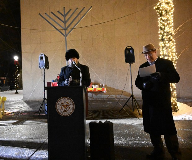 Rabbi Rabbi Yaacov Halperin speaks before leading a prayer Monday, Dec. 15, 2025, during a Hanukkah menorah lighting at Payrow Plaza in Bethlehem. Monday was the second night of the eight-day Jewish Festival of Lights. (Amy Shortell/The Morning Call)