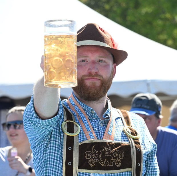 Ryan Waldron competes in the stein-holding competition Sunday, Oct. 5, 2025, at the 15th annual Oktoberfest at SteelStacks in Bethlehem. The festival continues Oct. 10-12. (Amy Shortell/The Morning Call)