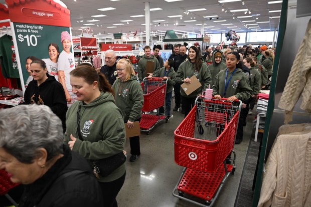 Nineteen children get ready to shop with their Lehigh-Northampton Airport Authority Police Department partners Saturday, Dec. 6, 2025, at Target in Allentown during Shop with an Airport Cop. (Amy Shortell/The Morning Call)
